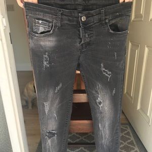 Italian brand DSquared black distressed jeans.